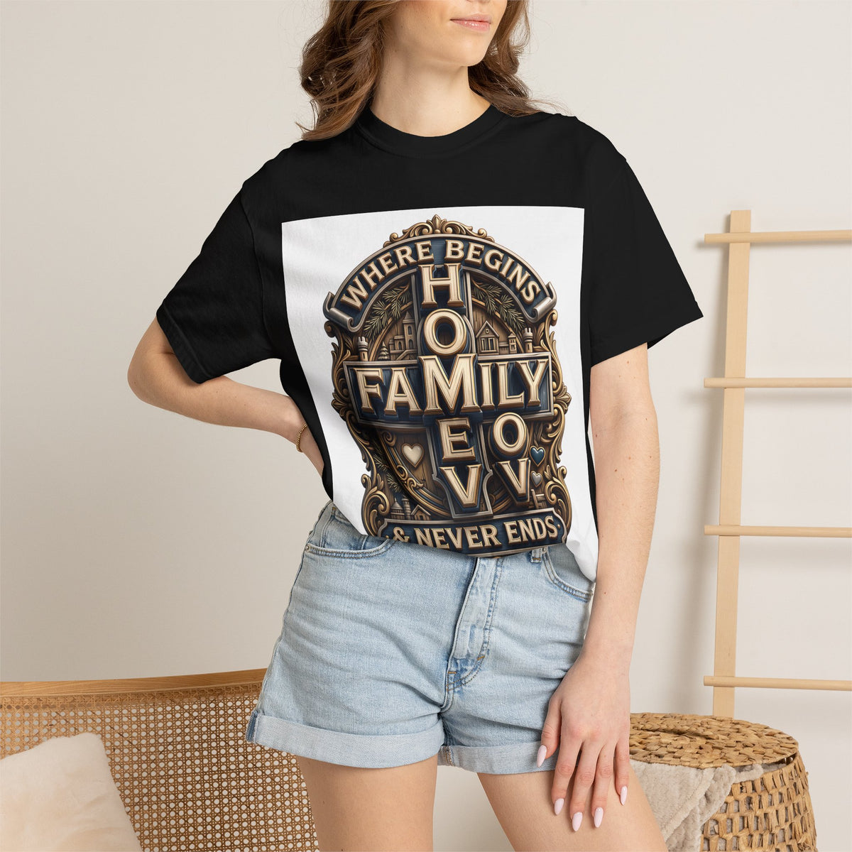 Woman wearing the black home family love crest t-shirt with denim shorts